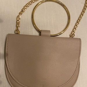 Low profile bracelet bag in neutral tone